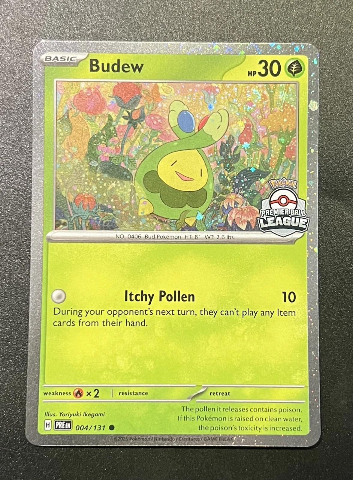 Prismatic Evolutions Budew [Premier-Ball-League] Pokémon card